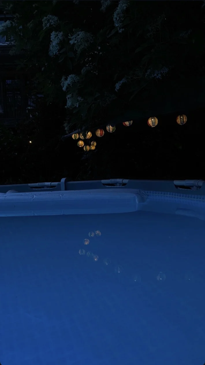 The pool glowing blue after dark